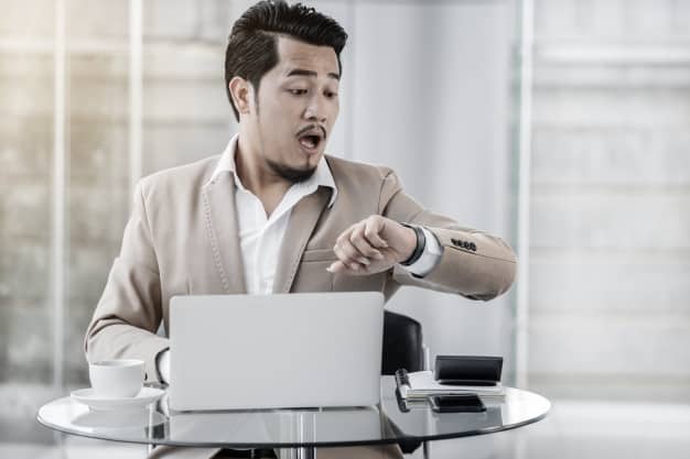 This business man looking at his watch knows that a private driver Miami is the best ground transportation option.