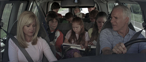 This large family in a minivan knows how stressful family travel can be and chauffeured long distance car service is key.